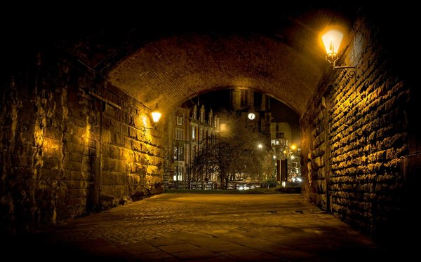 In which UK cities can tourists participate in underground tunnel tours?